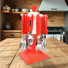 Stainless steel cutlery set with a revolving stand on a dining table.