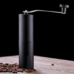 Siplix portable stainless steel manual coffee grinder standing upright.