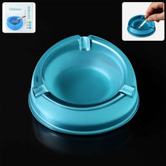 Transparent plastic ashtray with three cigarette rest slots and wide bowl