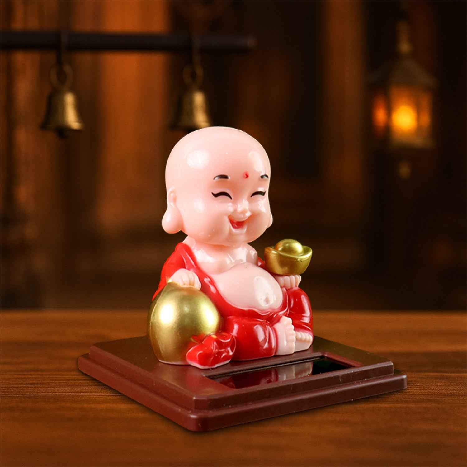 Colourful Solar Buddha Car Ornament with a gently nodding head, perfect for dashboard decor.