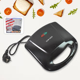 Dabster 2-slice sandwich maker with non-stick plates on a kitchen counter.