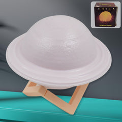 Vibrant 3D Saturn Lamp glowing with multicolor light on a dark background.