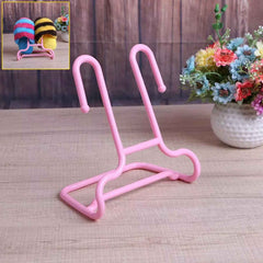 Multi-function shoe rack stand with integrated drying hanger in a modern home setting.