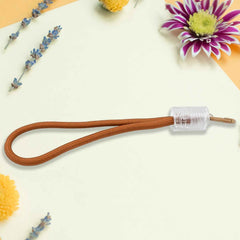 Versatile wrist strap lanyard holding a phone, keys, and a USB drive, showcasing its multipurpose use.