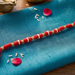 Handmade Red Rakhi with White Beads Ð Traditional Celebration Accessory