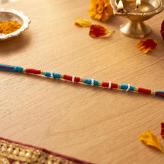 Handmade Pearl Beaded Rakhi Ð Elegant Traditional Gifting
