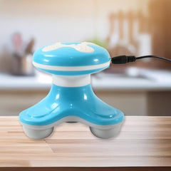 The triangle design massager providing soothing vibrations on an arm muscle.