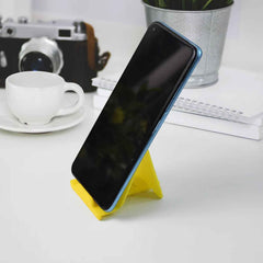 Compact foldable plastic mobile phone stand for desk use