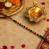 Designer Rakhi Ð Handmade with Golden Beads & Ethnic Threads