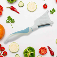 Multipurpose peeler brush showcasing its stainless steel blade and ergonomic handle.