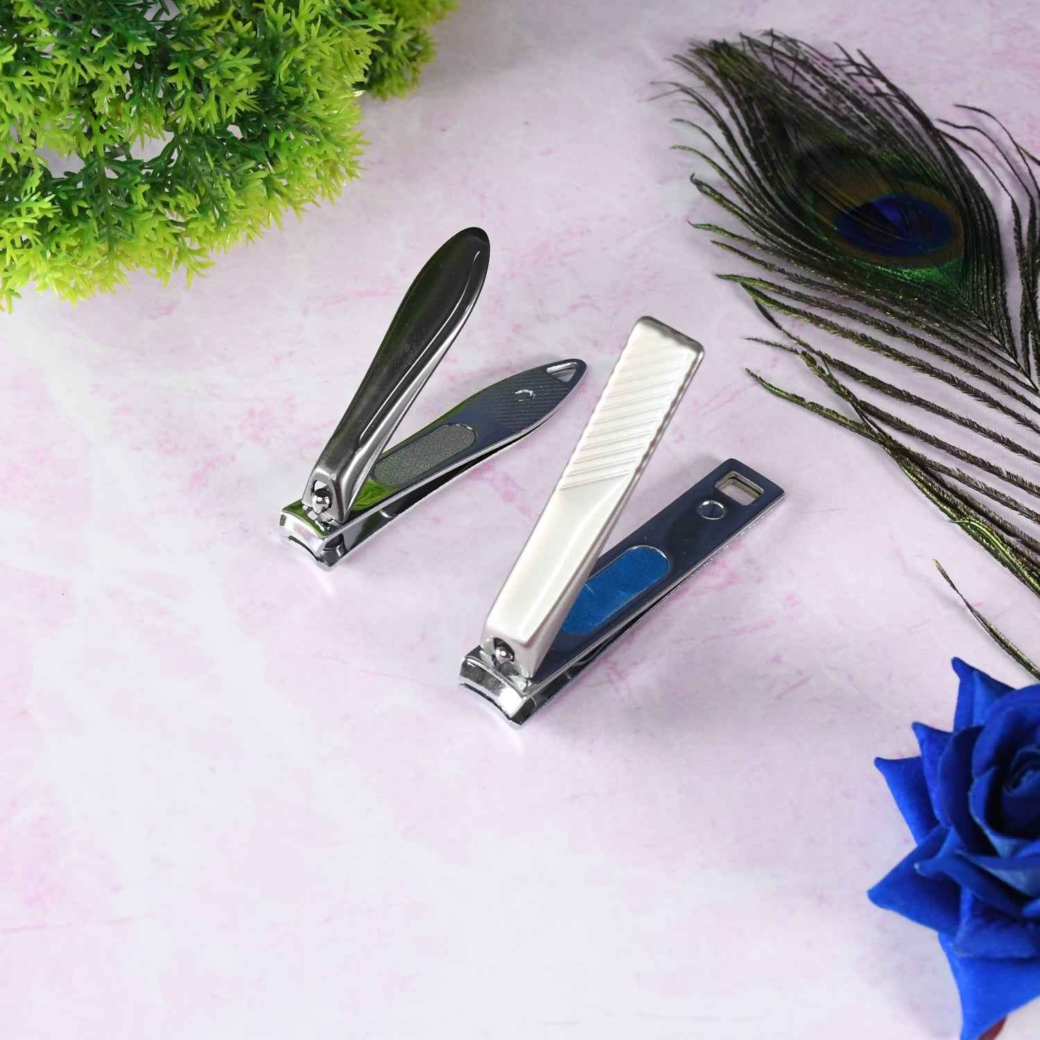 Compact stainless steel folding nail clippers in a closed position.