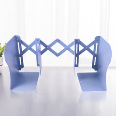 Heavy-duty metal book holder with scissor mechanism in study setting