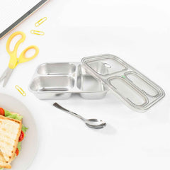 Stainless steel lunch box showing three separate food compartments for school meals