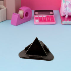 Close-up of pyramid design phone stand supporting a smartphone