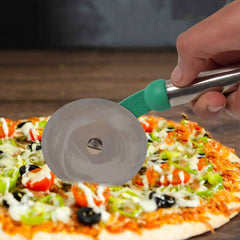 A hand demonstrating the Quickslice stainless steel pizza cutter slicing through a freshly baked pizza.