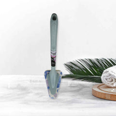 Triangular Sponge Brush effortlessly cleaning a kitchen sink.