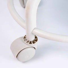 Side view of low rolling stool showing cushioned seat and sturdy wheels