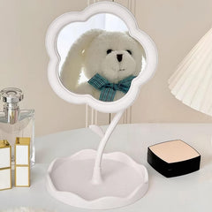 Hand adjusting the angle of the rotatable flower makeup mirror