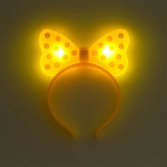 Side view of LED glowing bow hairband on white background