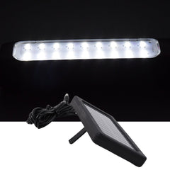 Eco shine mode lit on outdoor hanging solar LED light in garden setting