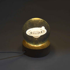 The astronaut 3D crystal lamp glowing softly, creating an ambient atmosphere.