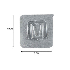 Multiple self-adhesive transparent hooks neatly organized on a surface.
