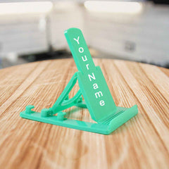 Sturdy plastic mobile phone stand with adjustable tilt in use