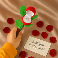 Ring storage box showing velvet lined interior in rose design