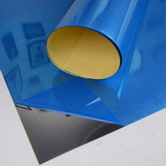 3D mirror tiles enhancing a TV backdrop with a stylish, reflective effect.