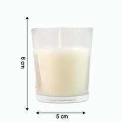 The Sweet Dreams Scented Votive Candle creating a serene ambiance on a bedside table.