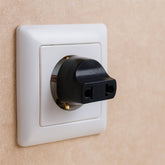 2 Pin Plug Adapter for universal to Indian sockets, shown in its color box packaging.