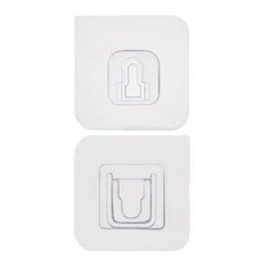 Adhesive wall hooks holding various kitchen utensils, showcasing their versatile use.