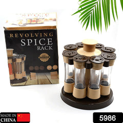 A hand selecting a spice jar from the 360-degree revolving spice rack, showcasing its ease of use.
