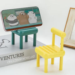 PHOBIA Mini Chair Phone Stand made from beech wood on a desk.