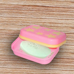 Side view of the star-shaped soap dish, highlighting its compact size.