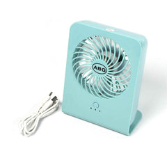 Close-up of the quiet four-blade design within the portable desk fan.