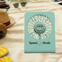 Front view of the VoltDesk portable desk fan with protective grille.