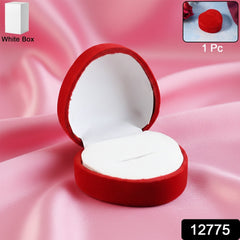 Open velvet ring box showing smooth white cushioned interior holding ring securely