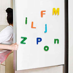 Brightly coloured magnetic letters displayed on a whiteboard, ready for learning.