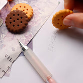 Set of 6 biscuit-shaped erasers in a clear display box, perfect for kids' stationery.