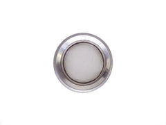 Stainless steel drain strainer placed inside a kitchen sink, ready for use.