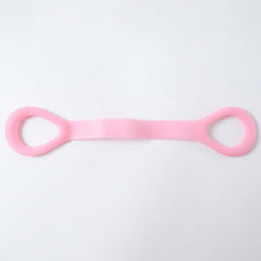 Woman using resistance band for arm exercises during workout