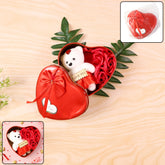 Heart shaped Valentineβs gift box featuring a teddy bear and scented roses