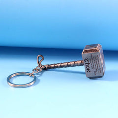 Metal hammer keychain with sturdy metal ring holding keys