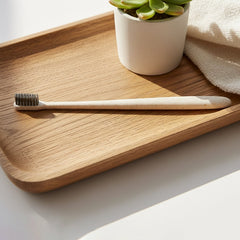 Close-up of the ultra-soft, activated carbon bristles of the MintGuard Soft-bristle Toothbrush.