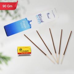Burning Agarbatti incense sticks creating a serene ambiance during a pooja ceremony.