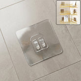 GlimmerHome transparent adhesive wall hook mounted on a clean, smooth wall.