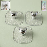 Strong clear adhesive wall hook holding keys and bags on a white wall.
