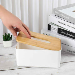 Bamboo tissue box holder viewed from a slight angle, showcasing its design.