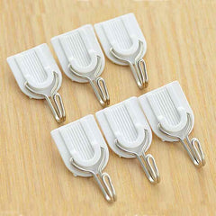 Damage-free self-adhesive hook securely holding multiple towels.